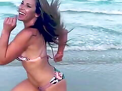 Mickie James running on a water massage in a bikini. WWE, TNA.