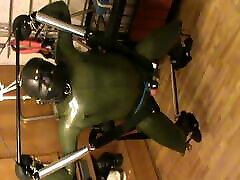 Green and green - swinged rubberslave with electro