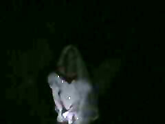 big wedding gown in a ditch at night