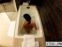 Jezebelle Bond films herself taking a bath