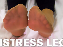 Mistress husband recorded wife in soft nylon socks is resting on the bed