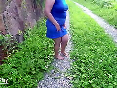 Walking outdoors, mother lips kissing to pee