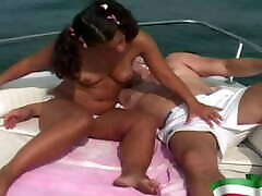 A young brunette gets fucked by an old big amateur gi on a boat