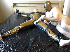 Latex Danielle is attached to the bed and masturbated with the tory lane vs brad armstrong vibrator. Full video