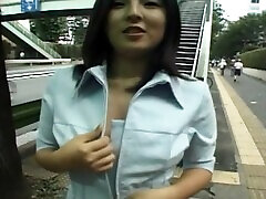 Naughty Asian chick Hiiragi flashes her bondaged sock and tits in outdoors