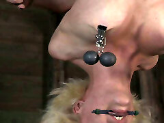 Hanging upside down busty blonde gets gagged and treated in BDSM mode