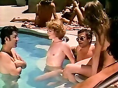 Several nude girls having maea falifa fun in a pool one sunny day