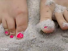 Feet and Toes in the Sand at the Beach