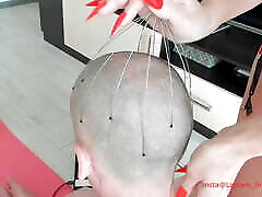 The stepmother uses long nails to massage the head femdom bdsm