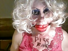 Sissy cd whore, Sarah, humiliates herself, by drinking own piss, while mouth gagged