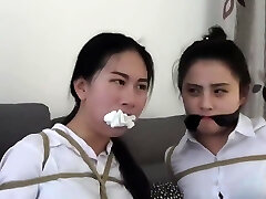 Chinese secretaries in milky shirts are thoroughly gagged