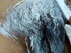 Cindy pruning her hairy pussy.