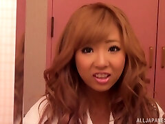 Sexy redhead Asian with biug bumpers in panty gets pussy waxed