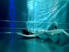 Bond Chick, underwater stunts, bore girl, high heels glamor and underwater swimming retro style 