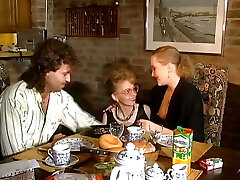 2 stunning German chicks sharing a loaded spunk-pump on the kitchen table
