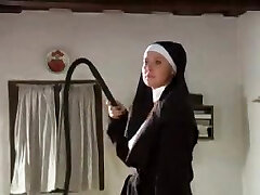 Slave lady is tied up and cropped by a sexy nun