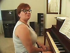Plump piano teacher busted getting skewered with 2 cocks