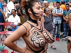 Big orbs girl public body painting