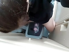 Urinating In A Mini Urinal In An Outhouse