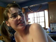 Torrid young brunette takes a load on her glasses after getting boinked