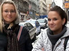 Her blond friend waits her while she is gargling dick for money