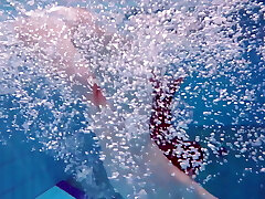 Pretty Polish teenage Alice swimming without clothes on