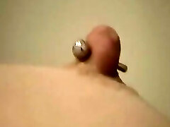 My friend's Girlfriend called Anne gets her nice puffy nipples pierced