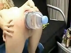 Ginormous plastic water bottle stretches out her pussy