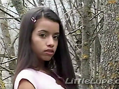 Little Lupe masturbates her tight pussy in the woods