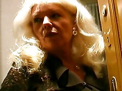 Old and busty German granny in tights enjoys making a hard-on cum