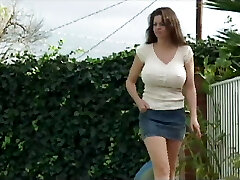 This ever naughty MILF tempts a guy with a big hard cock and