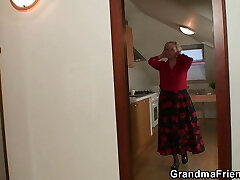 Very old blonde granny satisfies two workers
