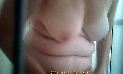 My wife loves to wank with the shower head and I love her hairy pussy