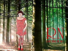 Pin-up lady posing in the forest. She shows her tits and pussy. Mesh tights. Special effect.
