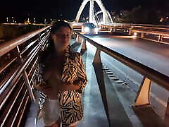 Luscious Milf walks without Bra and Panties on the Bridge