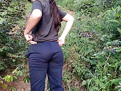 A cute slim Latina girl walks outdoors and flashes her big boobs and ass