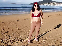 Woman Pissing on a Public Beach While No One Is There
