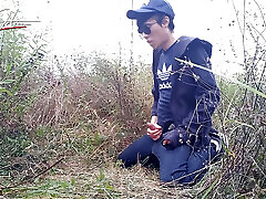 Cute gay Asian twink Jon Arteen speaks French wanks his smooth penis in the rain, lubricated with his saliva moans ejaculates