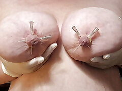 Piercing my bound nipples