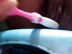 Horny women fuck her pussy using toothbrush deep inside while bathing caught