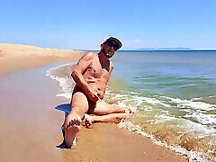 Nudist Couple Having Pegging Session on the Beach