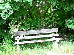 Kinky brunette chick pulls down her black thongs and pisses on bench