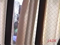 Busty Jap whore seen fucking hard through a window