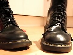 Girl wiggles her toes in soft, well worn female 3gps Martens and crushes a toy car