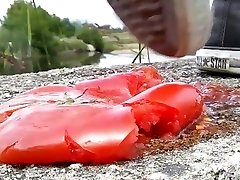 Tomato crushed under All Star Converse sneakers