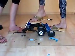 2 women stomp toy car