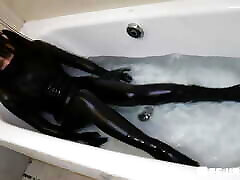 Fejira thicke red head Fetish girl in leather taking a bath in the bathtub