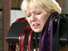 BDSM action with leathered up redhead exploiting blondes body