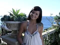 Tattooed cutie Veronica Lavery poses nude in the doorway